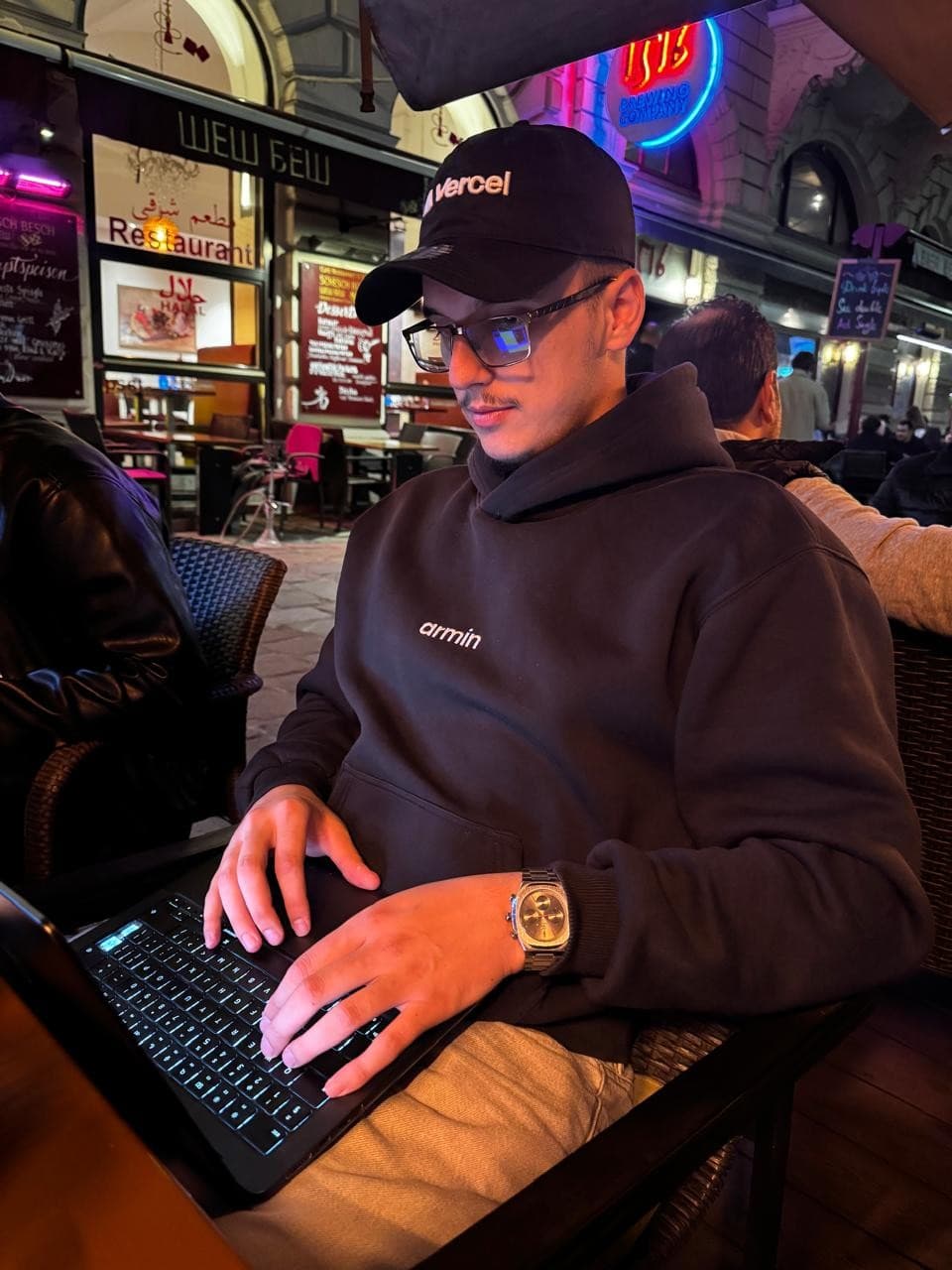Ergini at work on a laptop